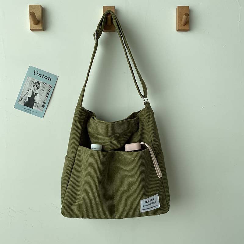 Women's canvas shoulder bag with corduroy details in Green
